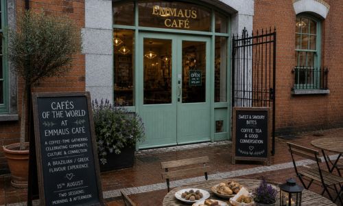 The entrance to Emmaus Cafe with food on the table