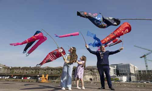 Lord Mayor with young people and fish flags