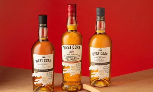 Three bottles of whiskey placed on a counter top