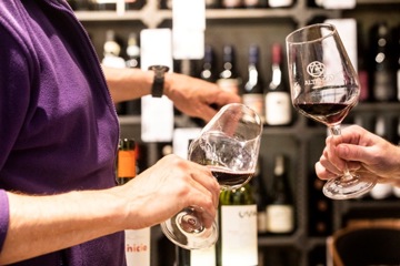 Employees pouring wine