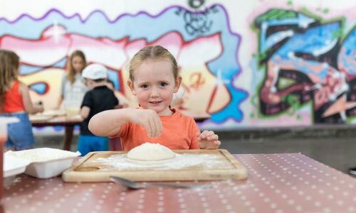 Oakfire Pizza Making Demo Young Girl making pizza base