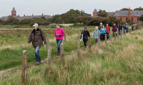 Group walking in a line in Tramore Valley Park