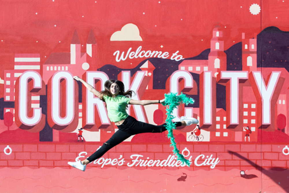 Dancer against welcome to Cork City backdrop