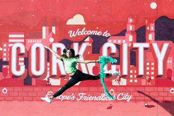 Dancer against welcome to Cork City backdrop